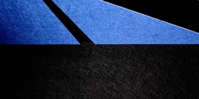 a close up of a black and blue background